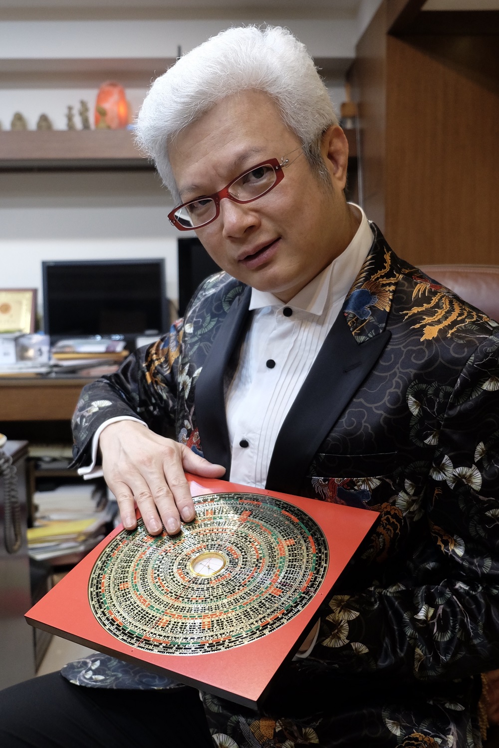 This photo taken on January 21, 2020 shows Taiwan-based fortune teller Tsai Shang-chi displaying a feng shui compass (luopan) at his office in Taipei. u00e2u20acu201d AFP pic 