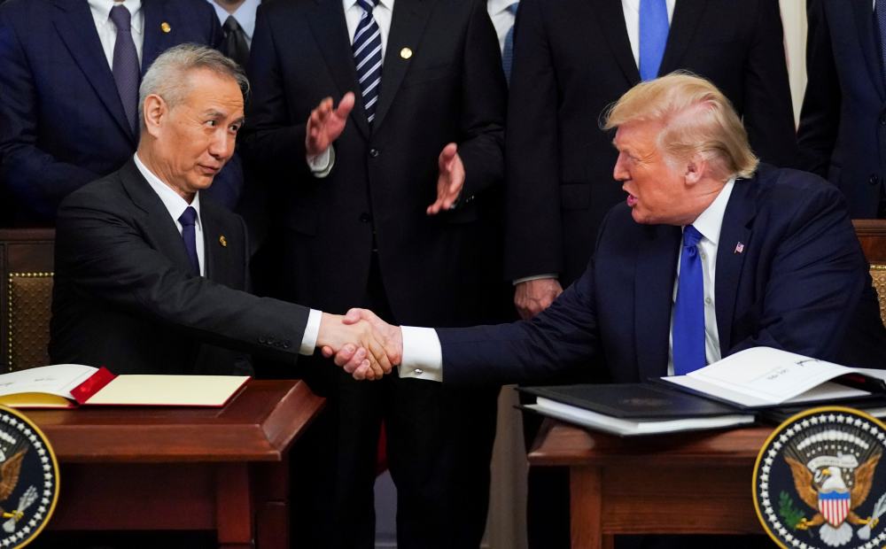 Chinese Vice Premier Liu He and US President Donald Trump shake hands after signing u00e2u20acu02dcphase oneu00e2u20acu2122 of the US-China trade agreement in Washington January 15, 2020. u00e2u20acu2022 Reuters pic
