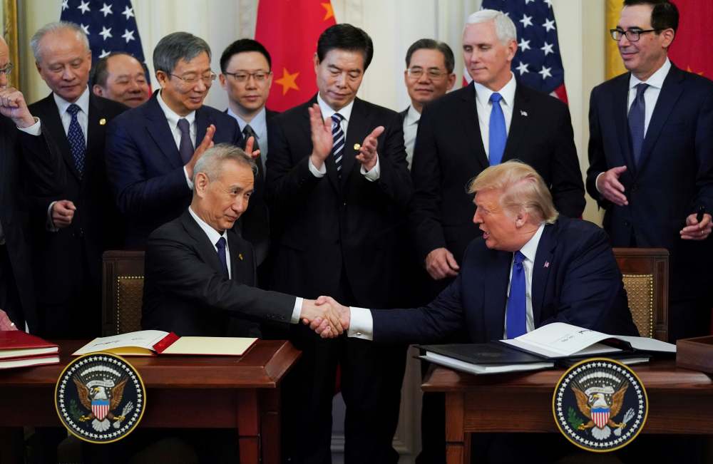 Chinese Vice Premier Liu He and US President Donald Trump shake hands after signing u00e2u20acu02dcphase oneu00e2u20acu2122 of the US-China trade agreement during a ceremony in Washington January 16, 2020. u00e2u20acu2022 Reuters pic