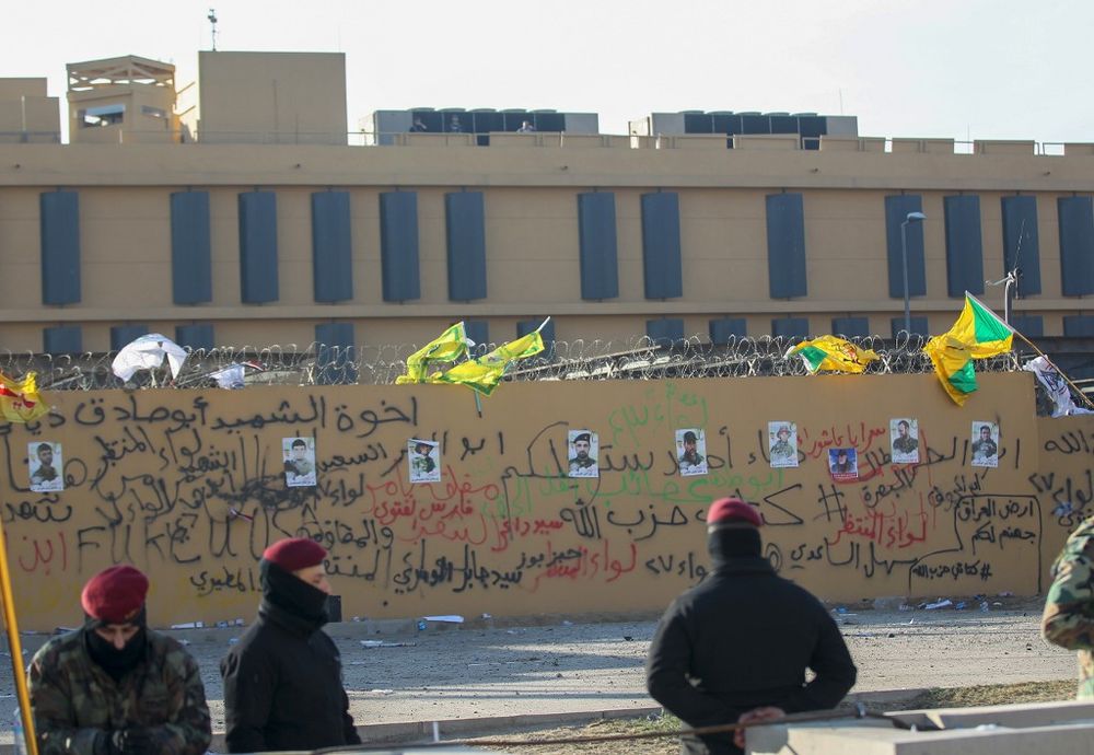The portraits of fighters from Kataeb Hezbollah (Hezbollah Brigades) seen on the wall of the US embassy in the Iraqi capital Baghdad on January 1, 2020, after they were placed by protesters following a demonstration. u00e2u20acu201d AFP pic