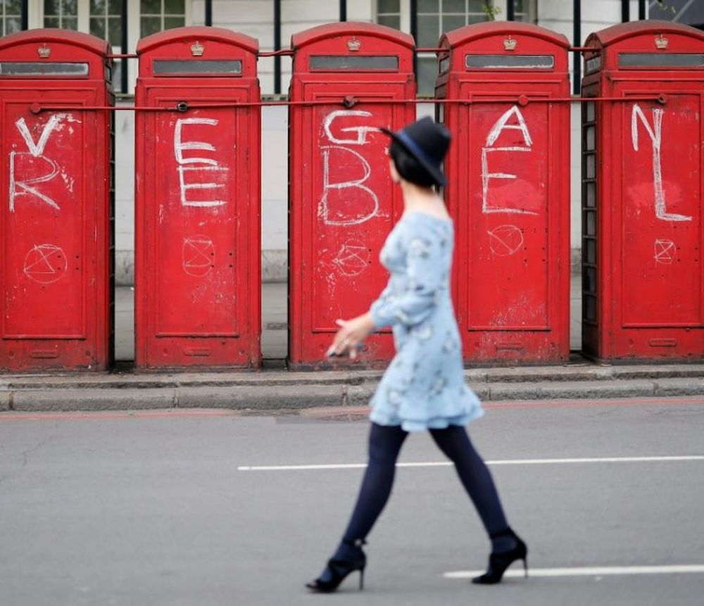 London phone boxes have been daubed by climate activists. u00e2u20acu201d AFP pic