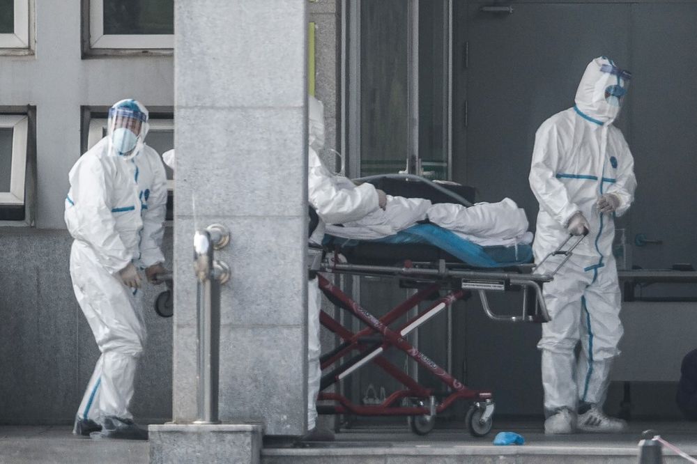 Medical staff members carry a patient into the Jinyintan hospital, where patients infected by a mysterious SARS-like virus are being treated, in Wuhan in Chinau00e2u20acu2122s central Hubei province on January 18, 2020. u00e2u20acu201d AFP pic