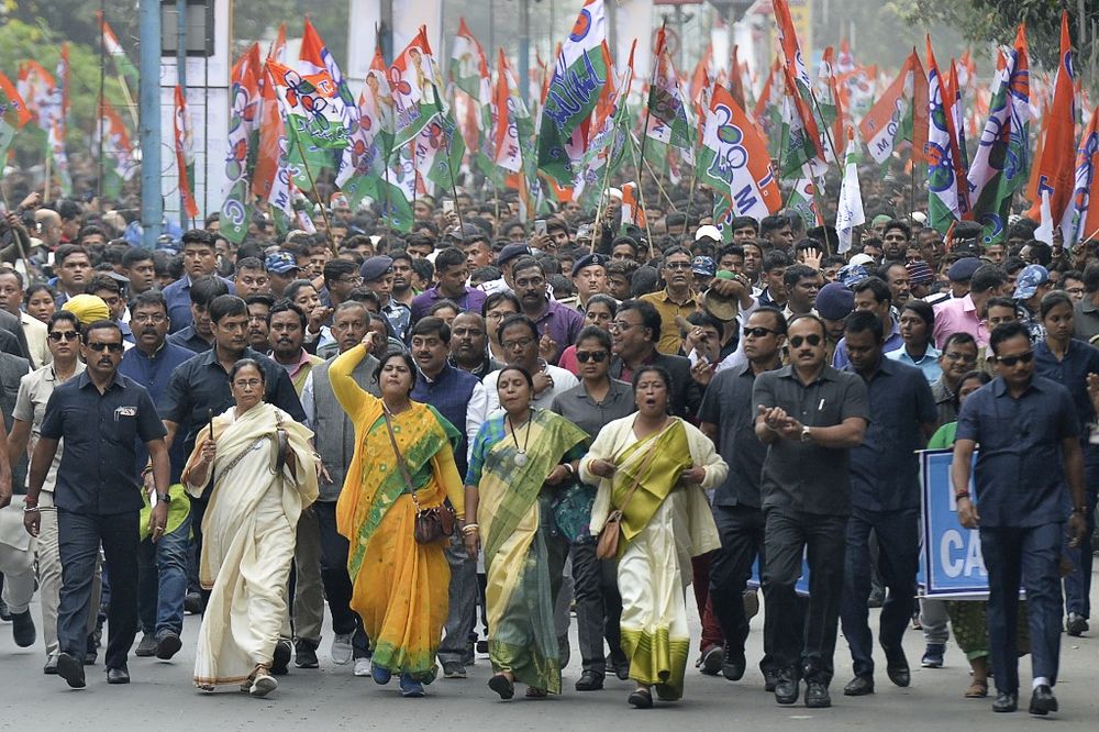 Chief minister of West Bengal state and leader of the Trinamool Congress (TMC) Mamata Banerjee (centre, dressed in white) along with party supporters walks in a mass rally to protest against the new citizenship law in Siliguri, January 3, 2020. u00e2u20acu201d AFP pi