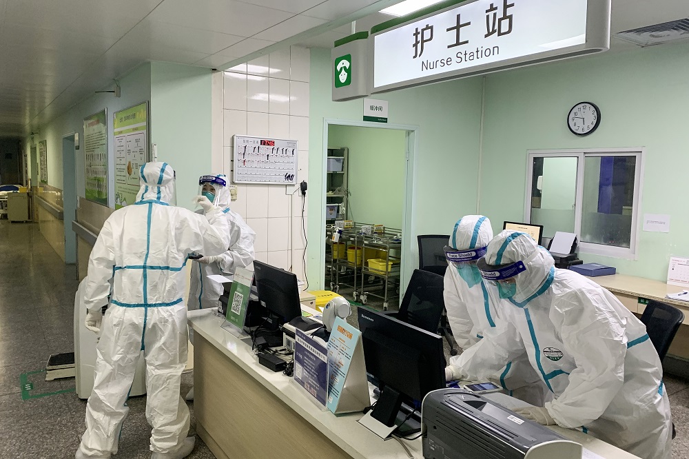 This photo taken on January 22, 2020 shows medical staff members wearing protective suits at the Zhongnan hospital in Wuhan in Chinau00e2u20acu2122s central Hubei province. u00e2u20acu201d AFP pic
