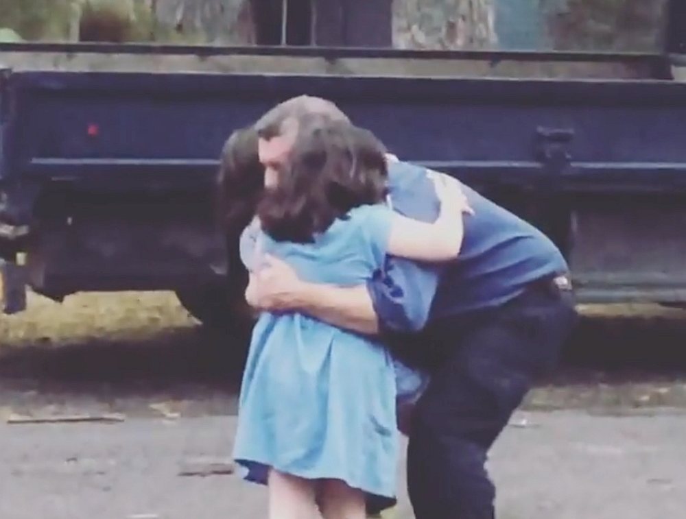 The daughters of a firefighter hug him as he returns home, after fighting fires for 11 days, in Narrawallee, New South Wales, Australia January 6, 2020. u00e2u20acu201d Instagram/@mrsbrookemunro video image via pic