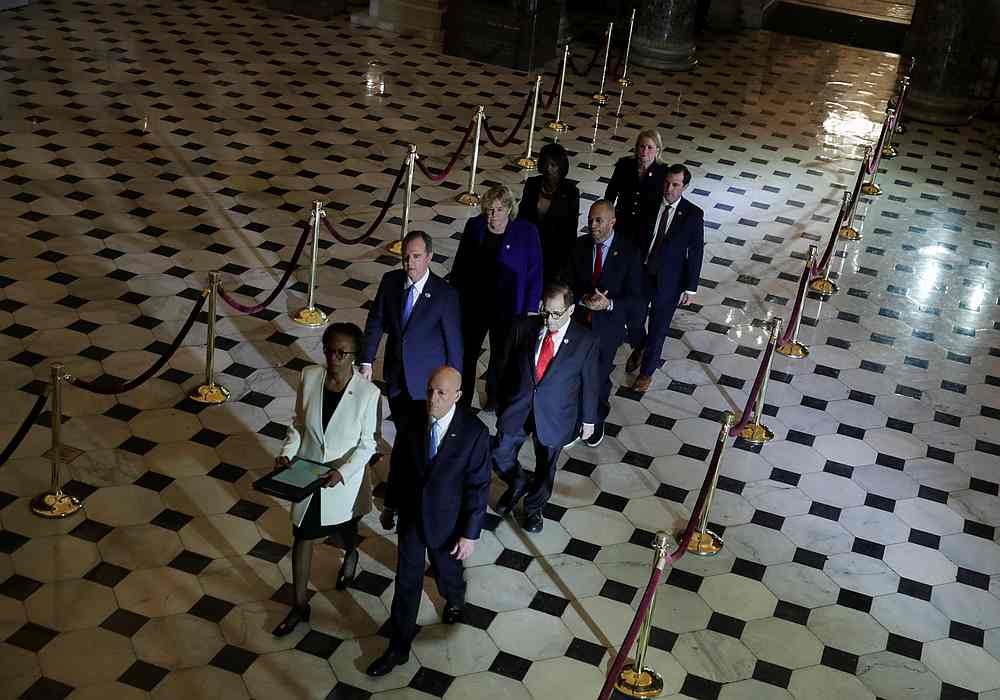 US House of Representatives Clerk Cheryl Johnson and Sergeant at Arms Paul Irving carry two articles of impeachment against US President Donald Trump through Statuary Hall in the US Capitol, Washington, January 15, 2020. u00e2u20acu201d Reuters pic