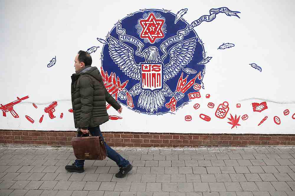A man walks past an anti-US mural on the wall of former US Embassy in Tehran, Iran January 21, 2020. u00e2u20acu201d Wana pic via Reuters
