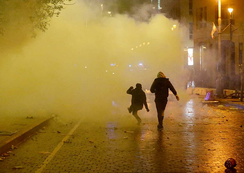Smoke rises as a demonstrator walks during a protest against a ruling elite accused of steering Lebanon towards economic crisis in Beirut, Lebanon January 19, 2020. u00e2u20acu201d Reuters pic