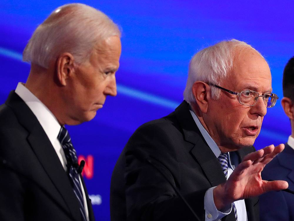 Former Vice President Joe Biden (left) listens as Senator Bernie Sanders speaks during the seventh Democratic 2020 presidential debate at Drake University in Des Moines, Iowa January 14, 2020. u00e2u20acu201d Reuters pic