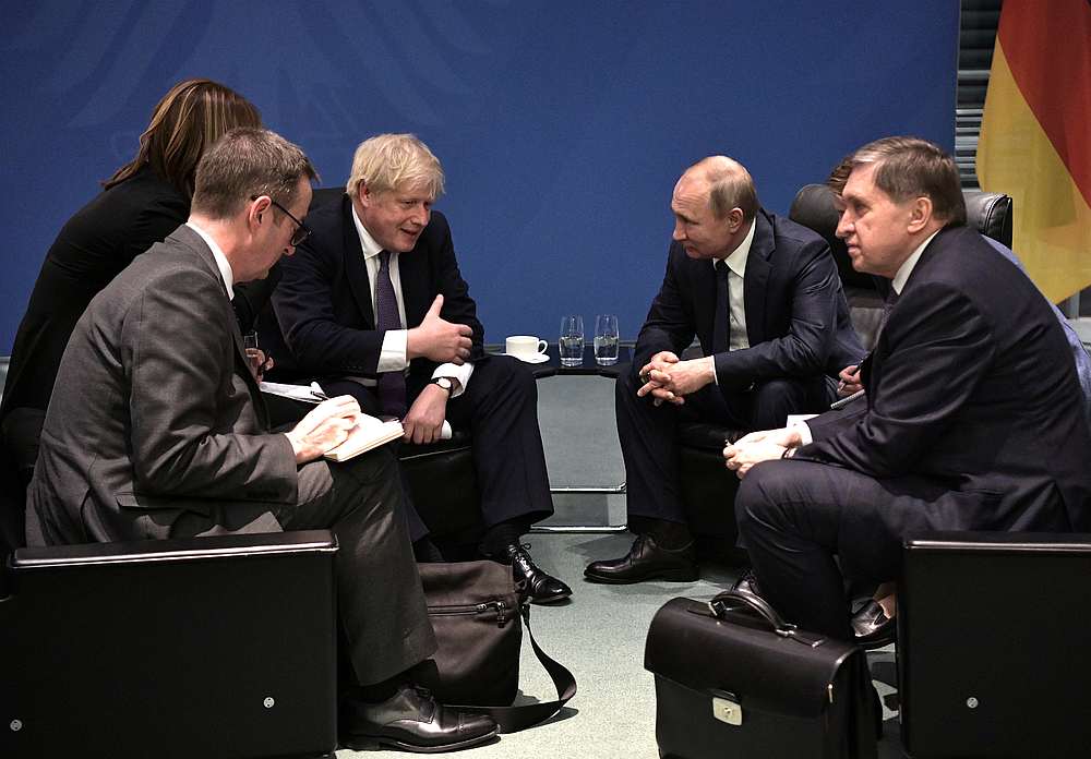 Russia's President Vladimir Putin (second right) and Britain's Prime Minister Boris Johnson meet on sideline of the Libya summit in Berlin, Germany January 19, 2020. u00e2u20acu201d Sputnik/Aleksey Nikolskyi/Kremlin pic via Reuters