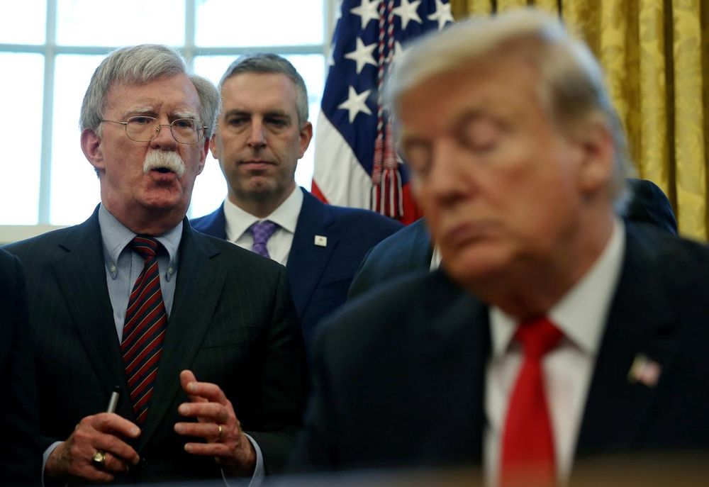 File picture shows US President Donald Trump listening as his national security adviser John Bolton speaks during a presidential memorandum signing for the u00e2u20acu0153Womenu00e2u20acu2122s Global Development and Prosperityu00e2u20acu009d initiative in the Oval Office, February 7, 2019. 