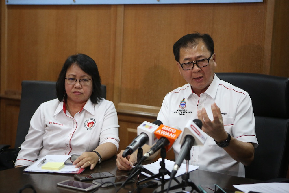 Dr Christina Rundi said it was time for authorities to review its mass immunisation programme. She is seen here with Datuk Frankie Poon during a press conference January 10, 2020. u00e2u20acu201d Picture by Julia Chan