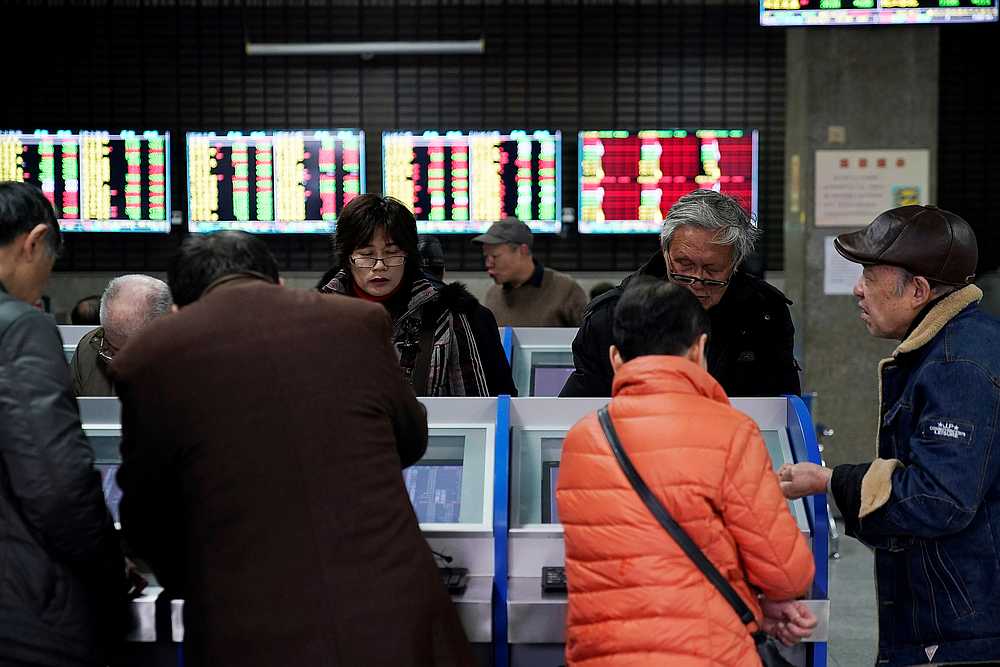 Investors look at computer screens showing stock information at a brokerage house in Shanghai, China January 16, 2020. u00e2u20acu201d Reuters pic