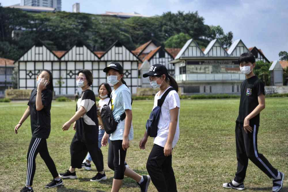 Tourists are seen wearing masks to protect themselves against the new coronavirus in Kuala Lumpur January 26, 2020. u00e2u20acu2022 Picture by Shafwan Zaidon