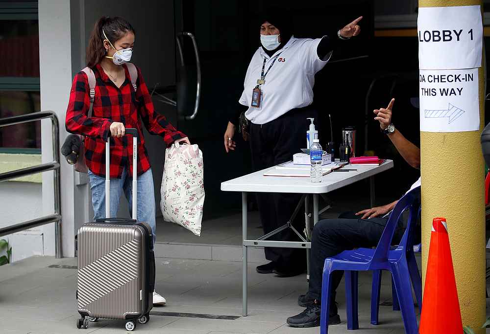 A student returning from China checks in to a dormitory designated as a quarantine zone within Nanyang Technological University in Singapore January 28, 2020. u00e2u20acu201d Reuters pic