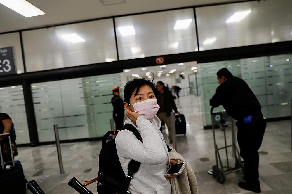 Tour agent Delfina Wang from Taiwan wears a surgical mask as a preventive measure in light of the coronavirus outbreak in China, at Mexico City airport January 24, 2020. u00e2u20acu201d Reuters pic