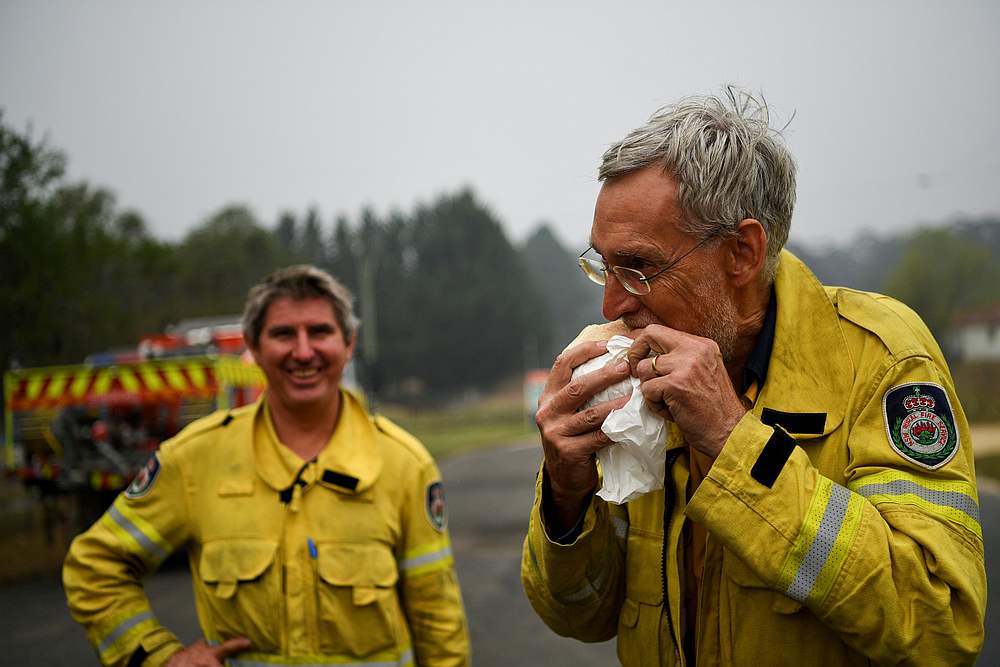 Fire fighters use the cooler weather to take a break as they wait for an encroaching fire to hit in Towanba, Australia January 7, 2020. u00e2u20acu201d Reuters pic