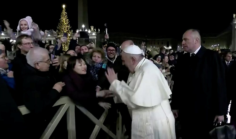Pope Francis slaps the hand of a woman who grabbed him at Saint Peter's Square at the Vatican in this still image taken from a video December 31, 2019. u00e2u20acu201d Vatican Media handout via Reuters