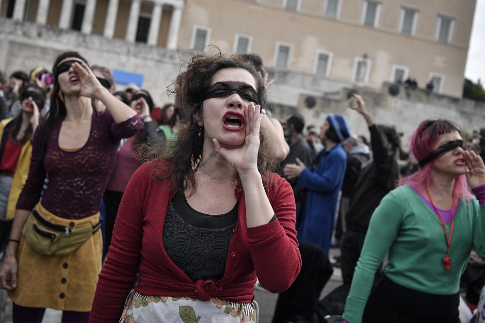 Female activists perform a choreography originated in Chile, and inspired by the Chilean feminist group Las Tesis, to protest against gender violence and patriarchy in front of the Greek parliament at Athens' Syntagma Square on December 22, 2019. u00e2u20acu201d AFP 
