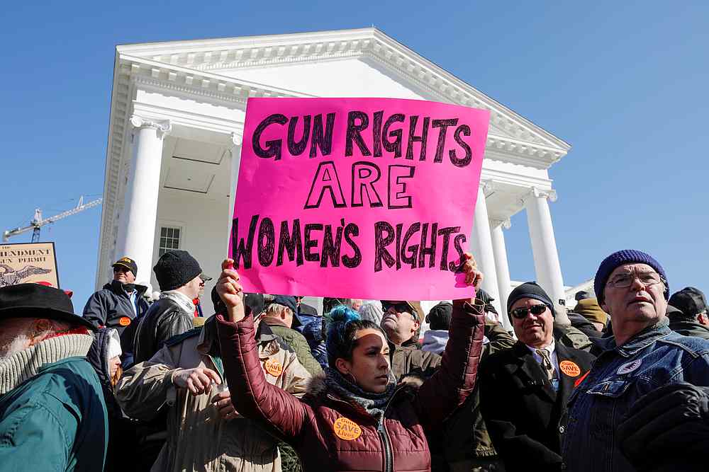 An activist holds up a sign supporting gun rights for women during a rally in front of the Virginia State Capitol building in Richmond, Virginia January 20, 2020. u00e2u20acu201d Reuters pic