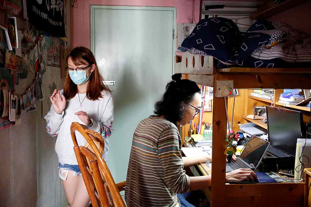 Derek Tai and his girlfriend Ann are seen at his apartment in Hong Kong January 22, 2020. u00e2u20acu201d Reuters pic