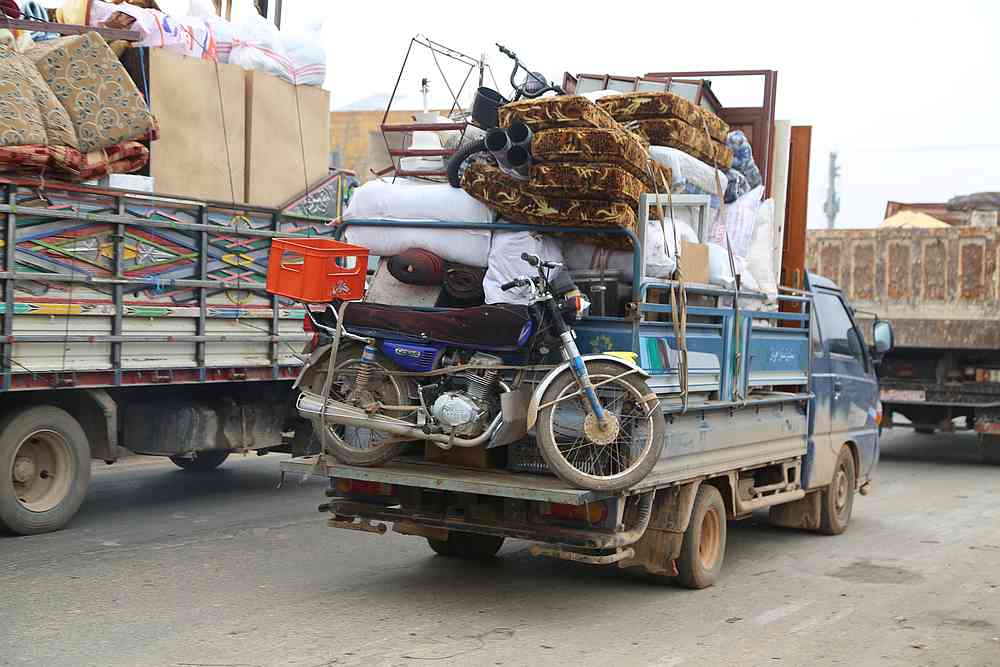 Trucks carry belongings of people fleeing from Maarat al-Numan, in northern Idlib, Syria December 24, 2019. u00e2u20acu201d Reuters pic 
