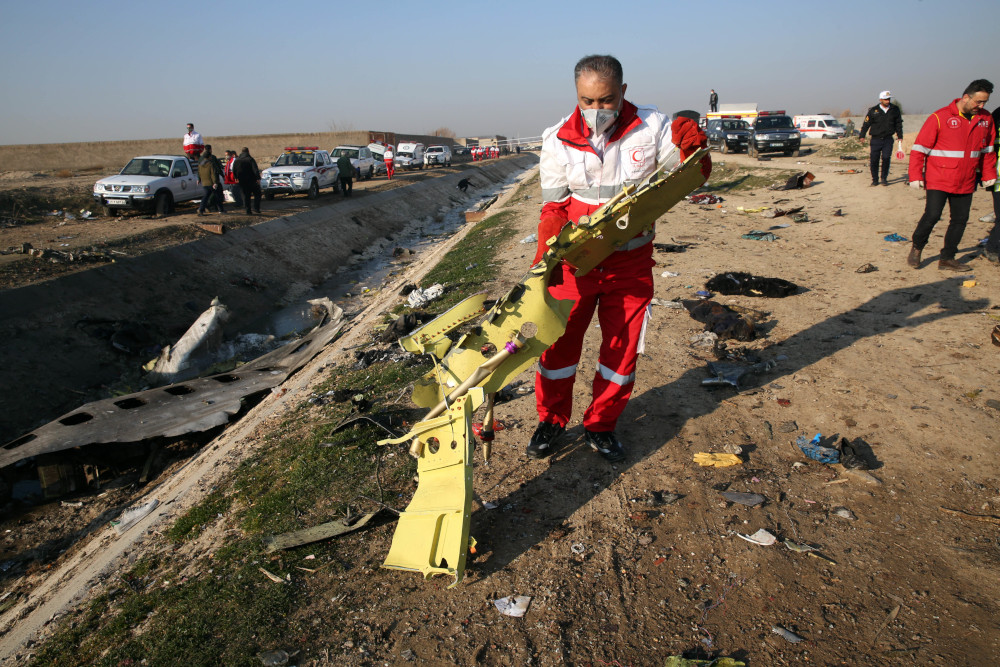 Rescue teams recover debris from a field after a Ukrainian plane carrying 176 passengers crashed near Imam Khomeini airport in the Iranian capital Tehran early in the morning January 8, 2020, killing everyone on board. u00e2u20acu201d AFP pic 