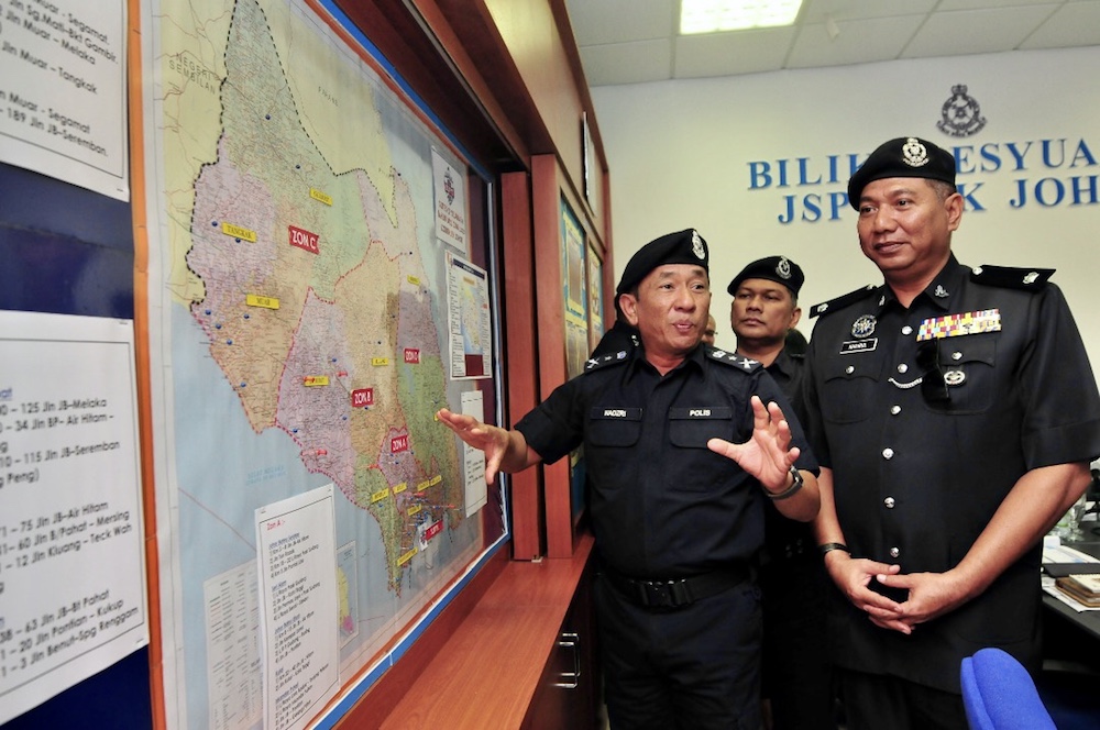 Senior Assistant Commissioner Datuk Mohd Nadzri Hussain shows the traffic accident hot spots while visiting the Johor police contingent headquarters in Johor Baru January 23, 2020. u00e2u20acu201d Picture by Ben Tan