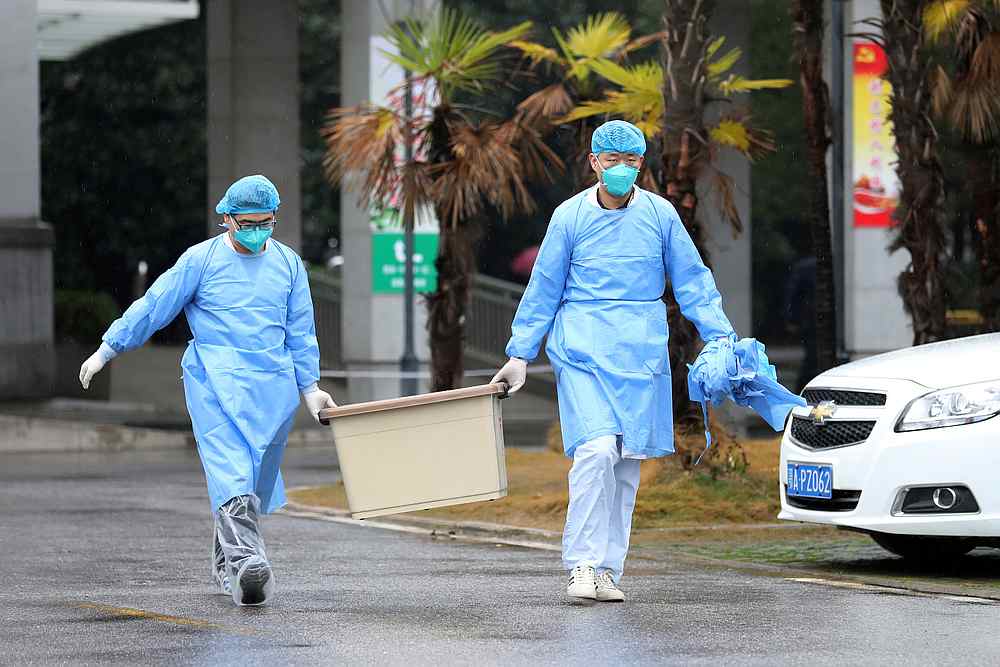 Medical staff carry a box as they walk at the Jinyintan hospital, where the patients with pneumonia caused by the new strain of coronavirus are being treated, in Wuhan, Hubei province, China January 10, 2020. u00e2u20acu201d Reuters pic