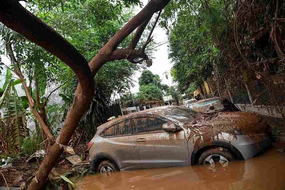 Cars damaged by floods following heavy rains at a residential area in Bintaro, Jakarta, Indonesia, January 3 2020. u00e2u20acu201d Antara Foto/Shafidz Mubarak via Reuters
