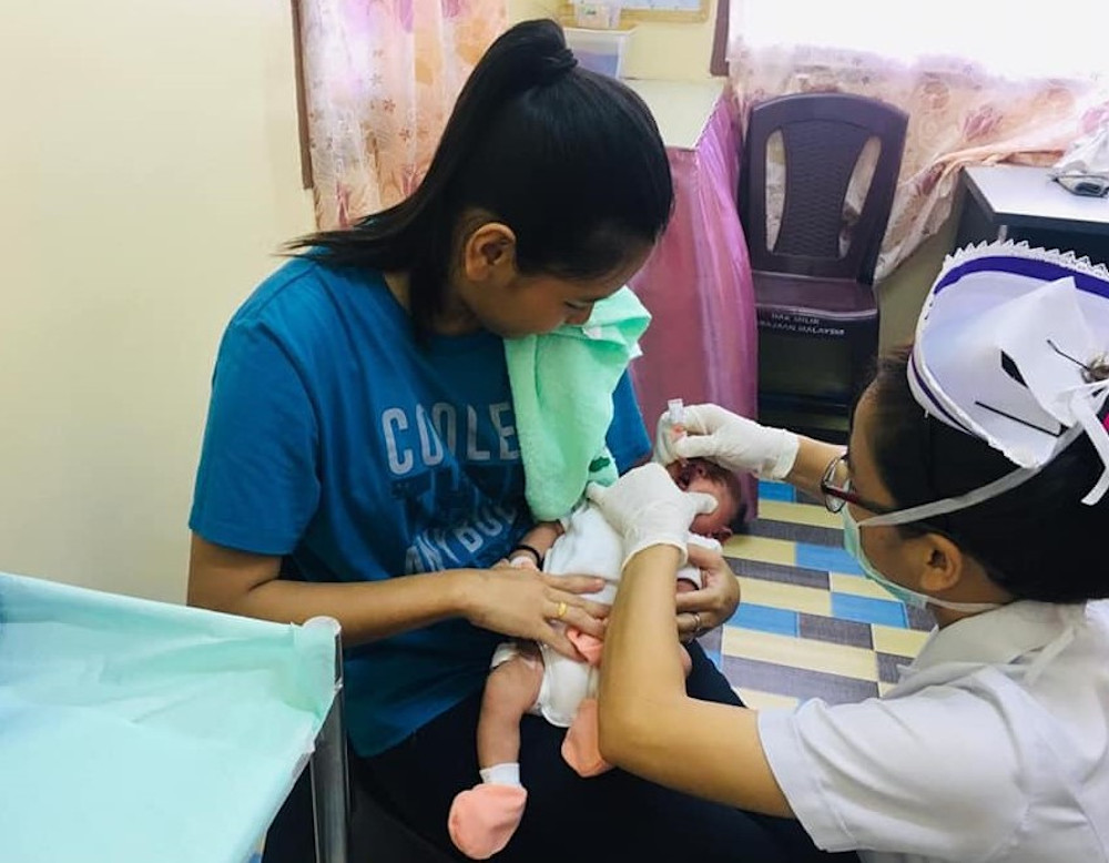 A nurse giving out free polio vaccine to a baby. u00e2u20acu201d Picture courtesy of Facebook/PKPKS.