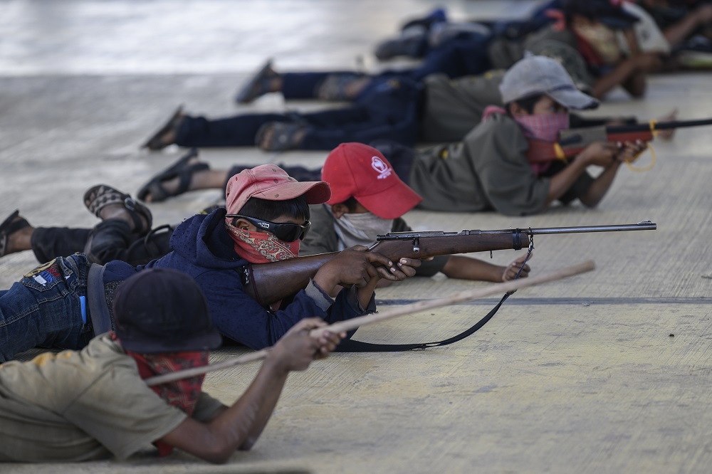 Children are taught to use weapons by the Regional Coordinator of Community Authorities (CRAC-PF) community police force at a basketball court in the village of Ayahualtempan, Guerrero State, Mexico January 24, 2020. u00e2u20acu201d AFP pic