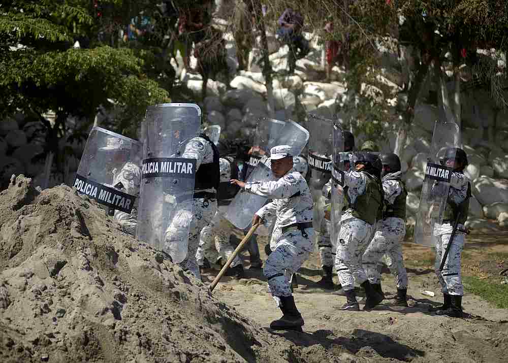Members of Mexico's National Guard hold their shields to block migrants, part of a caravan travelling to the US, near the border between Guatemala and Mexico, in Ciudad Hidalgo, Mexico January 20, 2020. u00e2u20acu201d Reuters pic