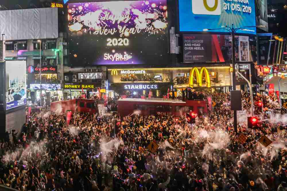 Revellers gather at Bukit Bintang to usher in the New Year, January 1, 2020. ― Picture by Firdaus Latif