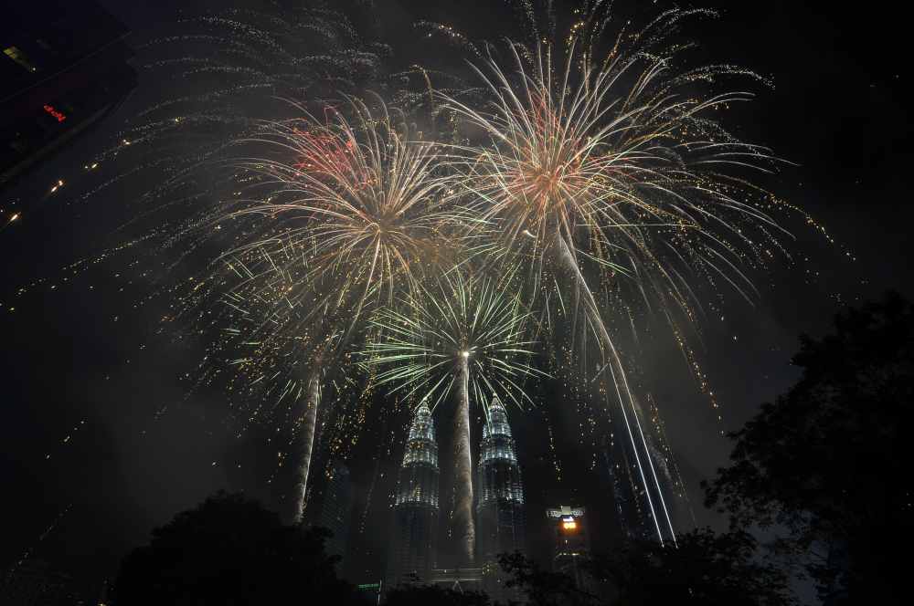 Fireworks explode over Kuala Lumpur City Centre to usher in the New Year on January 1, 2019. u00e2u20acu2022 Picture by Shafwan Zaidon