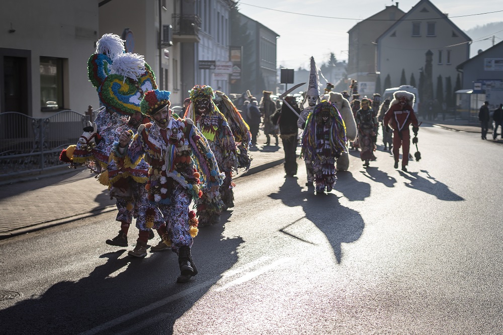 Participants of Dziady Zywieckie traditional folk custom are seen around the mountain town of Milowka in southern Poland January 18, 2020. — AFP pic