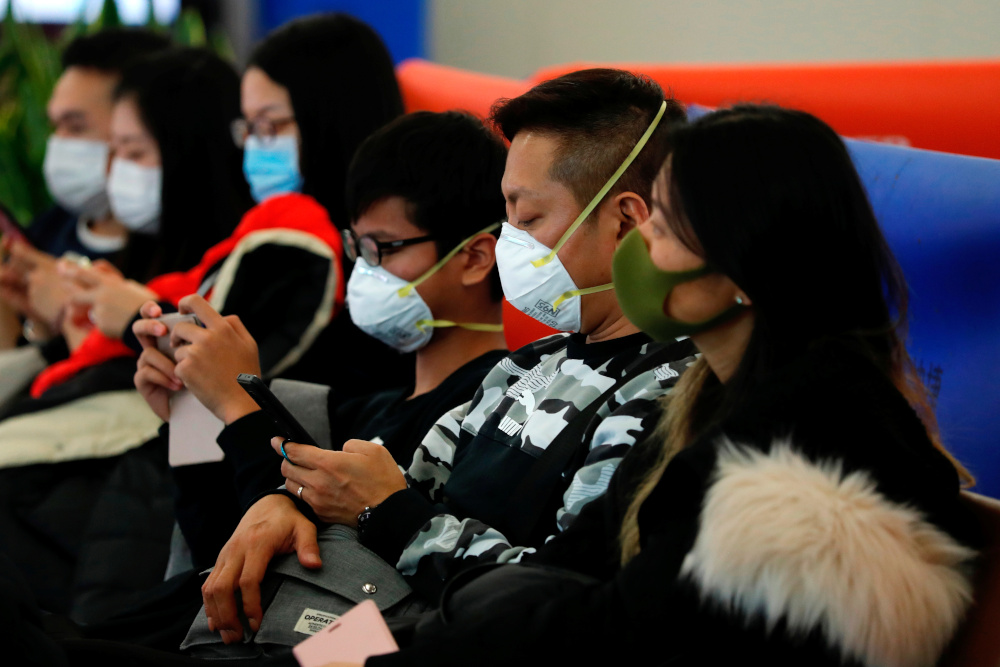Passengers wear masks to prevent an outbreak of a new coronavirus at the Hong Kong West Kowloon High Speed Train Station, in Hong Kong January 23, 2020. u00e2u20acu201d Reuters pic