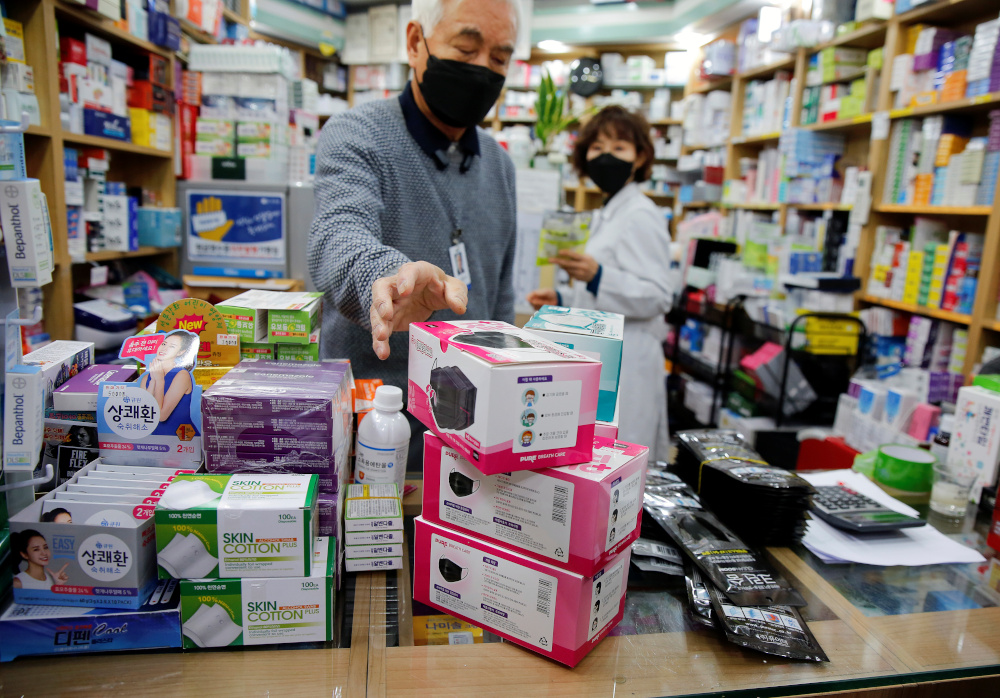 Pharmacist sells masks to prevent contracting coronavirus, at a pharmacy in the Myeong-dong in Seoul January 31, 2020. u00e2u20acu201d Reuters pic