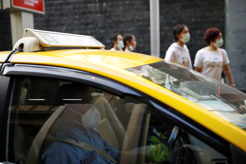 A taxi driver wears a protective face mask as he waits for passengers in front of a shopping mall in Bangkok January 31,2020. u00e2u20acu201d Reuters pic