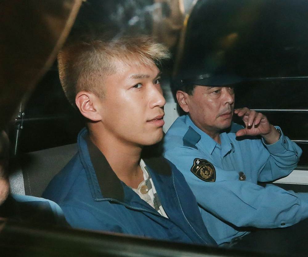  Murder suspect Satoshi Uematsu (left) as he returns to the Tsukui police station in Sagamihara, Kanagawa prefecture July 27, 2016. u00e2u20acu201d Jiji Press/AFP pic