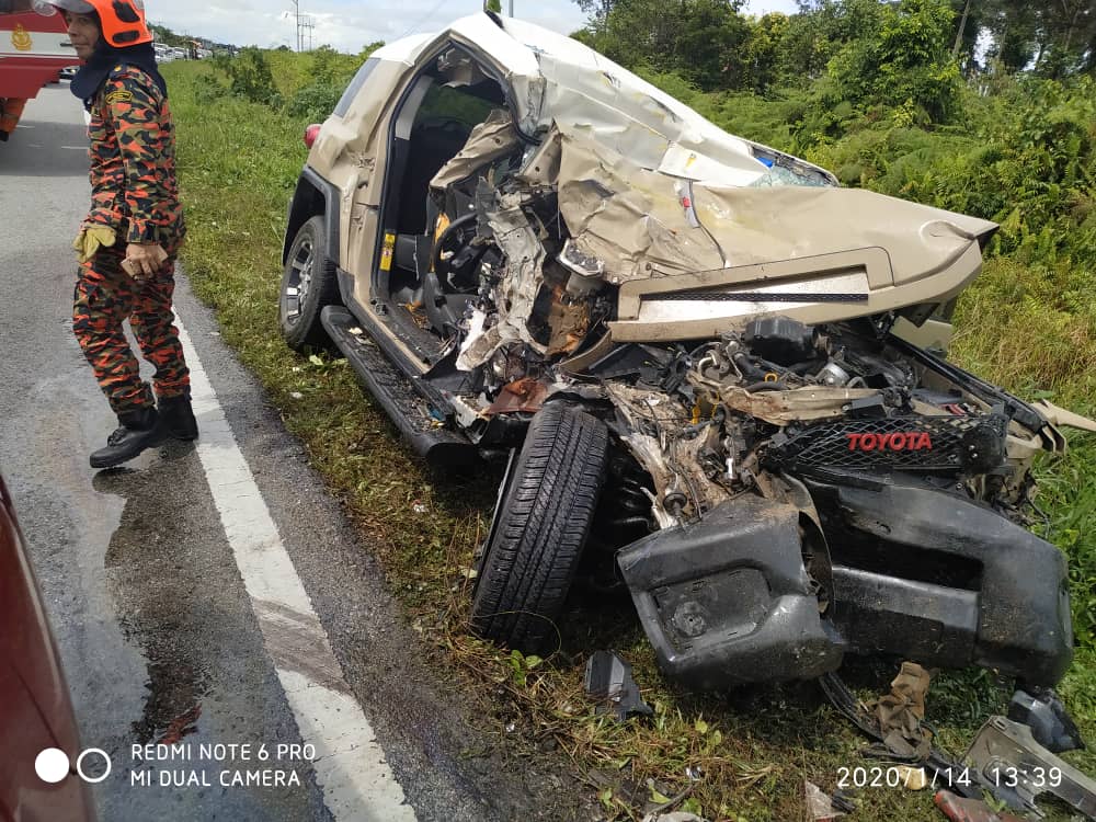 The badly damaged four-wheel drive vehicle is pictured following a collision with a lorry. u00e2u20acu201d Picture courtesy of the Simunjan Fire Department