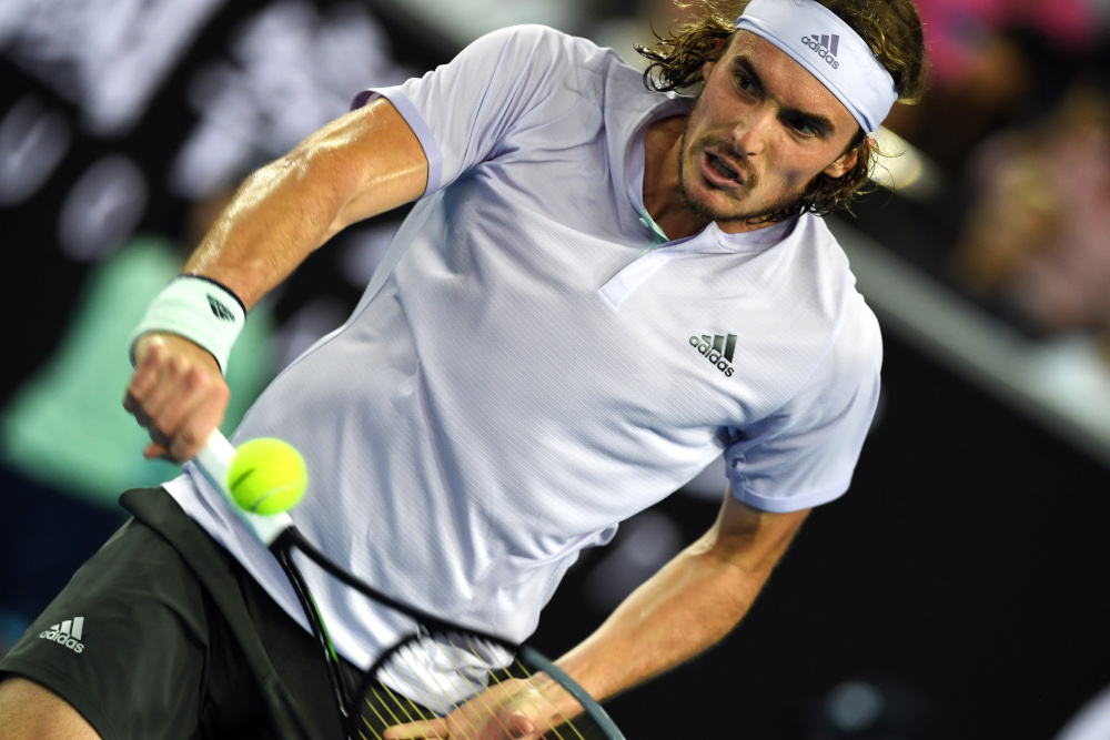 Greeceu00e2u20acu2122s Stefanos Tsitsipas hits a return against Italyu00e2u20acu2122s Salvatore Caruso during their menu00e2u20acu2122s singles match on day one of the Australian Open tennis tournament in Melbourne January 20, 2020. u00e2u20acu201d AFP pic
