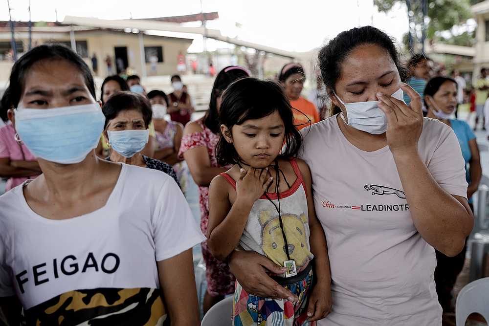 Residents displaced by Taal Volcano's eruption attend a Catholic mass in an evacuation centre, in Tagaytay City, Philippines January 19, 2020. u00e2u20acu201d Reuters pic 