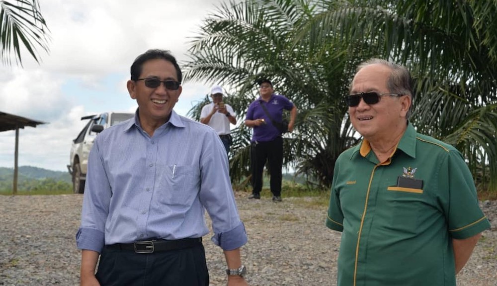 Deputy Chief Minister Datuk Amar Douglas Uggah (right) with Salcra acting general manager Joseph Blandoi at the Salcra oil palm estate in Saribas January 5, 2020. u00e2u20acu201d Picture courtesy of state Ministry of Agriculture, Native Land and Regional Development