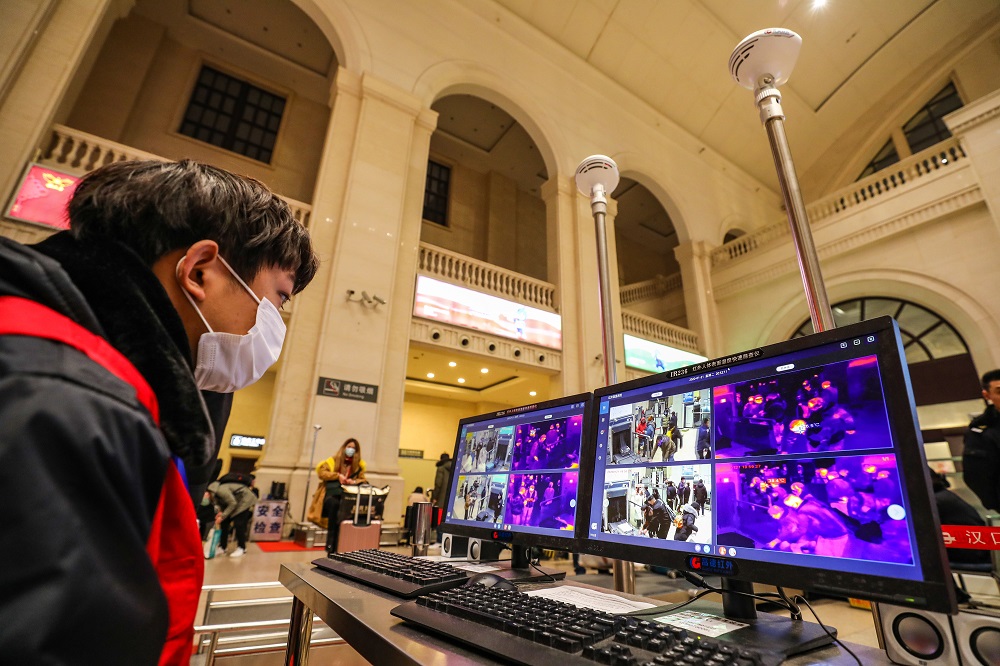 A staff member screens arriving passengers with thermal scanners at Hankou railway station in Wuhan, in China's central Hubei province on January 21, 2020. u00e2u20acu201d AFP pic