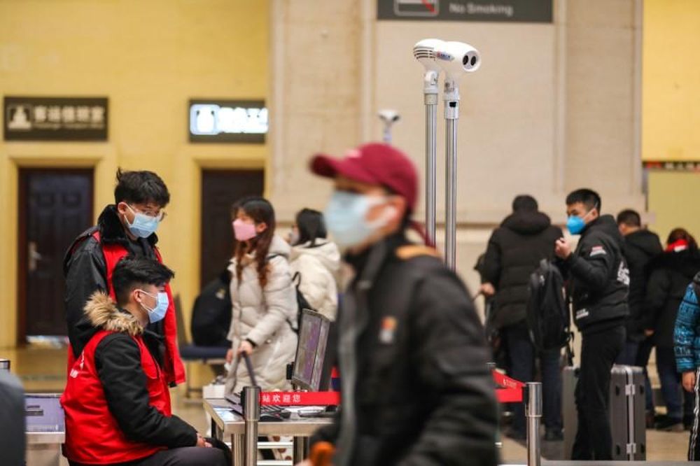 Staff members wearing masks monitor thermal scanners that detect temperatures of passengers at the security check inside the Hankou Railway Station in Wuhan, Hubei province, China January 21, 2020. u00e2u20acu201d China Daily pic via Reuters