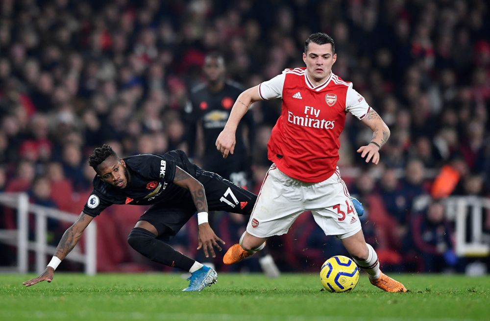 Manchester Unitedu00e2u20acu2122s Fred (left) in action with Arsenalu00e2u20acu2122s Granit Xhaka at the Emirates Stadium December 26, 2019. u00e2u20acu201d Reuters pic