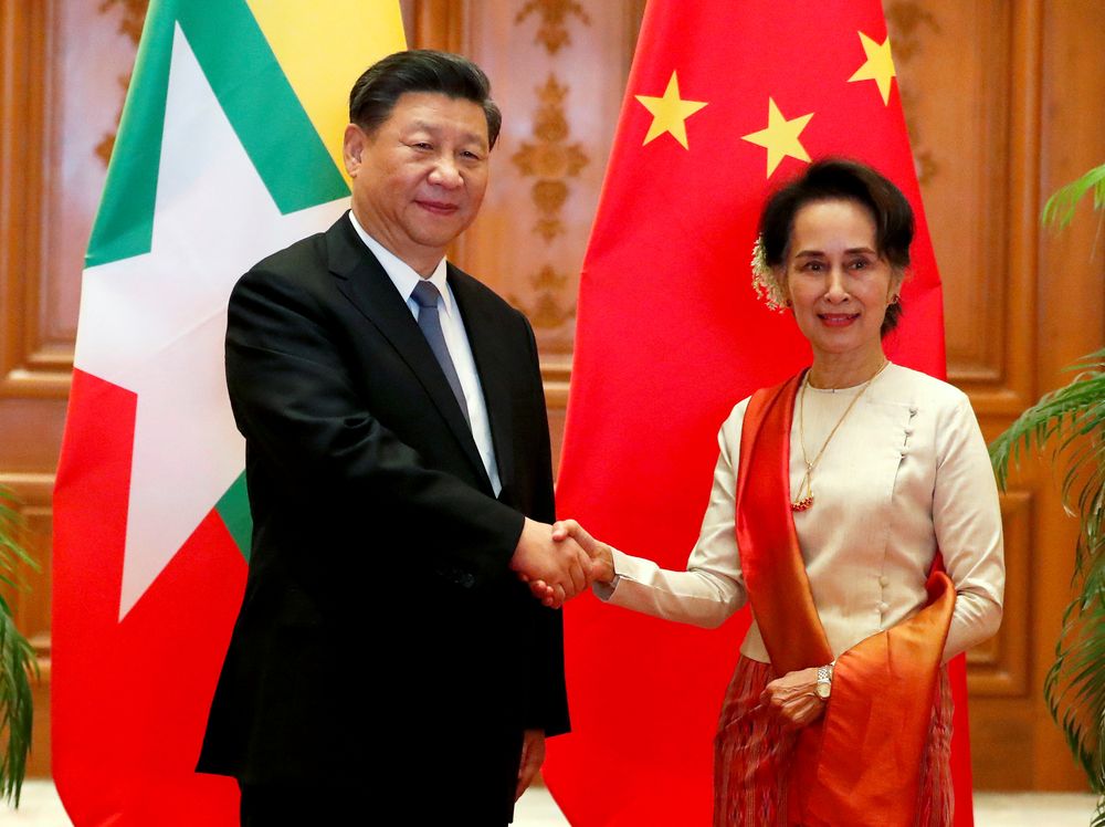 Myanmar State Counsellor Aung San Suu Kyi shakes hands with Chinese President Xi Jinping at the Presidential Palace in Naypyitaw, Myanmar, January 18, 2020. u00e2u20acu201d Nyein Chan Naing/pool pic via Reuters