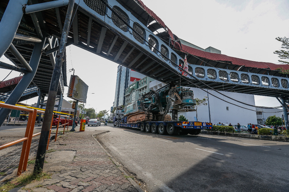 A 16-wheeler carrying a construction crane was seen almost ripping off a pedestrian bridge after part of the crane was stuck under it at Weld Quay in Penang February 5, 2020. u00e2u20acu201d Picture by Sayuti Zainudin