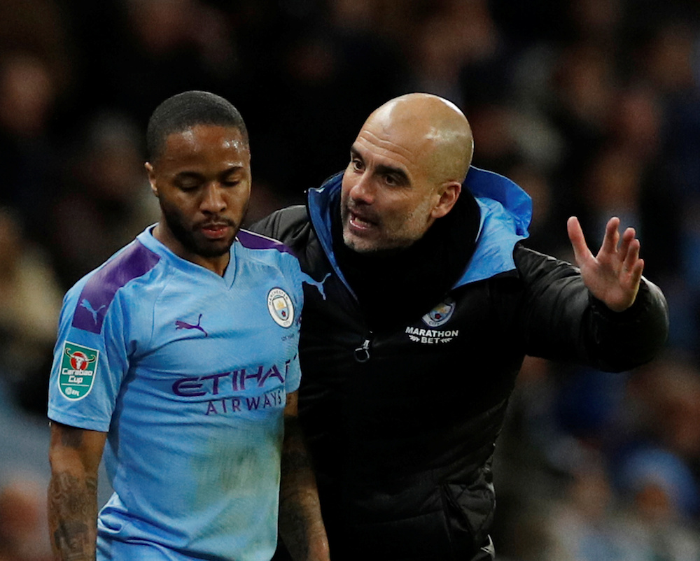 Manchester City manager Pep Guardiola with Raheem Sterling during the Carabao Cup semi-final second leg match with Manchester United at Etihad Stadium in Manchester January 29, 2020. u00e2u20acu201d Reuters pic